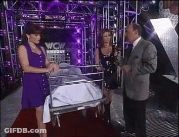Two Women And A Man On Red Carpet With WCW Sign GIF