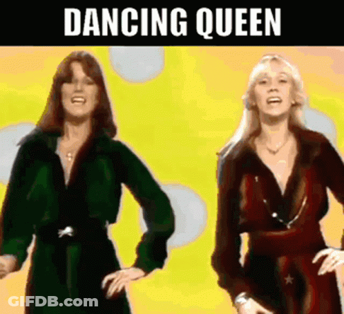 Two Women Are Dancing In Front Of A Yellow Background With The Words `` Dancing Queen '' Written Above Them . GIF