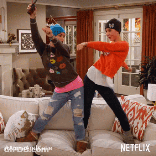 Two Women Dancing On Couch With Alexaandkatie Hashtag GIF
