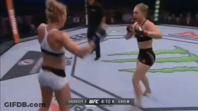 Two Women Are Fighting In A Boxing Ring With A Monster Energy Logo In The Background . GIF