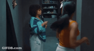 Two Women Are Having An Argument In A Room And One Of Them Is Wearing A Shirt That Says Tsl On It GIF
