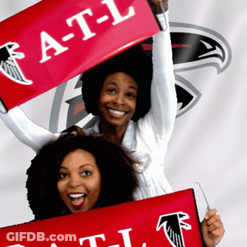 Two Women Are Holding Up A Red Banner That Says A-T-L GIF