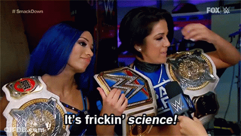 Two Women Are Holding Wrestling Championship Belts And Saying It 'S Frickin ' Science . GIF