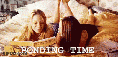 Two Women Reading On Bed Bonding Time GIF