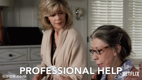 Two Women Are Looking At A Piece Of Paper And The Words Professional Help Are Visible GIF