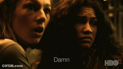 Two Women Are Looking At Each Other And The Word Damn Is On The Screen GIF
