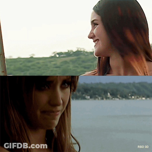 Two Women Are Looking At Each Other With The Words Rbd 3D On The Bottom Right GIF