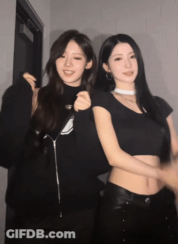 Two Women Are Posing For A Picture And One Has A Choker On GIF