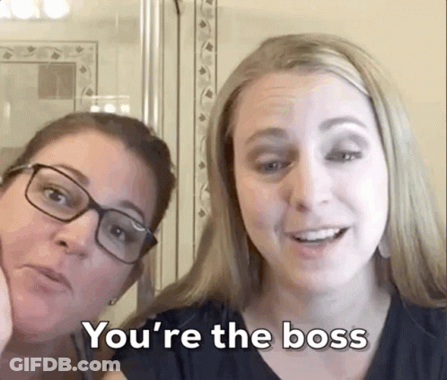 Two Women Are Posing For A Picture And One Of Them Says You 'Re The Boss GIF