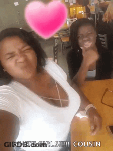 Two Women Are Posing For A Picture With A Pink Heart Above Them That Says White Girls !!! Cousin GIF