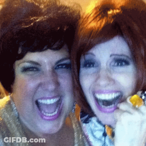 Two Women Are Posing For A Picture With Their Mouths Wide Open GIF
