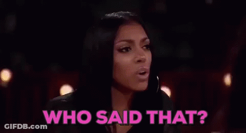 Two Women Are Sitting At A Table With Glasses Of Champagne And The Words `` Who Said That '' Above Them . GIF