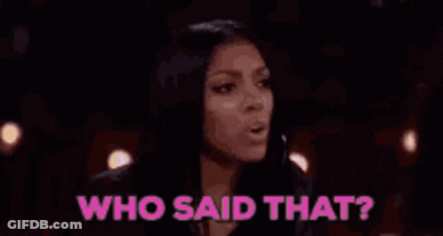 Two Women Are Sitting At A Table With Glasses Of Water And Champagne And The Words `` Who Said That '' . GIF