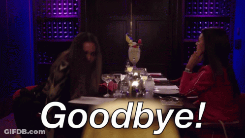 Two Women Are Sitting At A Table With The Words Goodbye Written On It GIF