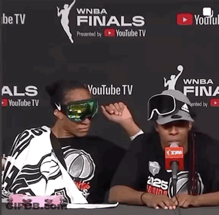 Two Women Are Sitting In Front Of A Youtube Tv Banner GIF