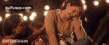 Two Women Are Sitting Next To Each Other And One Is Crying . GIF