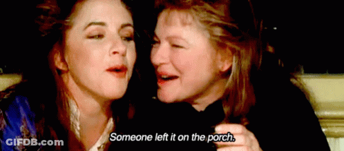 Two Women Are Sitting Next To Each Other And One Of Them Is Saying Someone Left It On The Porch GIF