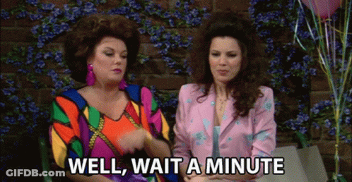 Two Women Are Sitting Next To Each Other And One Of Them Is Saying Well Wait A Minute GIF