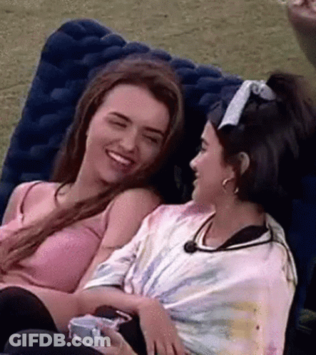 Two Women Sitting On Couch GIF