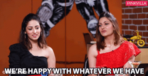 Two Women Are Sitting Next To Each Other With The Words We 'Re Happy With Whatever We Have GIF