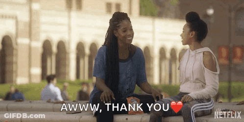 Two Women Are Sitting On A Ledge And One Of Them Is Saying Awww Thank You GIF