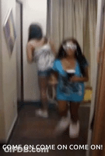 Two Women Are Standing In A Hallway With The Text Come On Come On Come On GIF