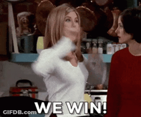 Two Women Are Standing In A Kitchen And One Of Them Is Saying We Win ! GIF