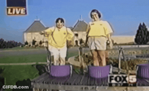 Two Women Are Standing In Purple Baskets With The Fox 5 Logo In The Background GIF
