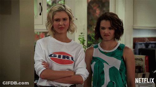 Two Women Standing One Wearing Girl Shirt GIF