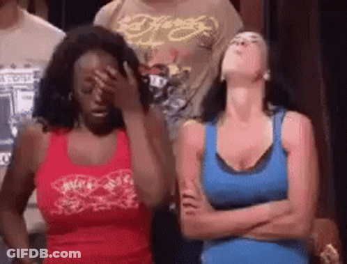 Two Women Are Standing Next To Each Other And One Is Covering Her Face . GIF