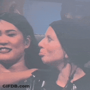 Two Women Are Standing Next To Each Other And One Is Making A Face . GIF