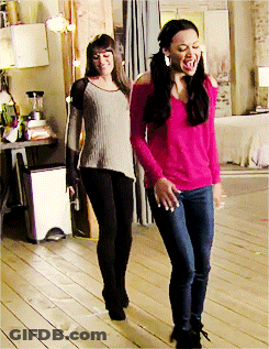 Two Women Are Standing Next To Each Other And One Is Wearing A Pink Top GIF