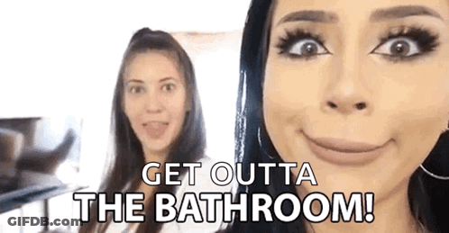 Two Women Are Standing Next To Each Other And One Of Them Is Making A Funny Face And Saying `` Get Outta The Bathroom ! GIF