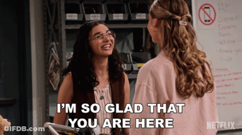 Two Women Are Standing Next To Each Other And One Of Them Is Saying I 'M So Glad That You Are Here GIF