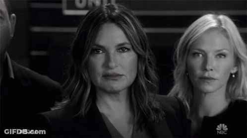 Two Women Are Standing Next To Each Other In A Black And White Photo With #Svu On The Bottom GIF