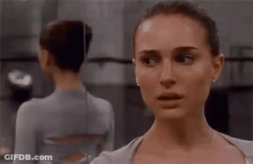 Two Women Are Standing Next To Each Other In A Dance Studio . GIF