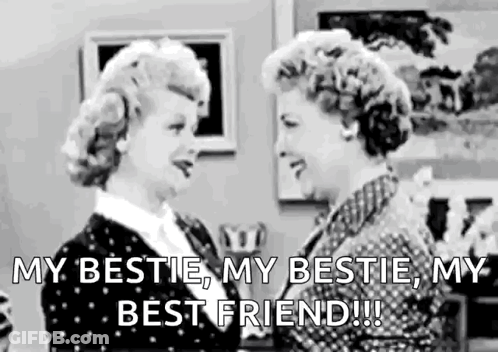 Two Women Are Standing Next To Each Other In A Living Room And Talking To Each Other . GIF