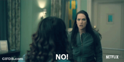 Two Women Are Standing Next To Each Other In A Room And One Is Saying No . GIF