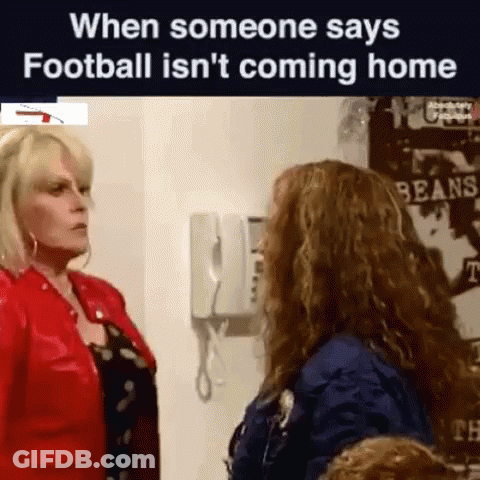 Two Women Are Standing Next To Each Other In A Room And Talking To Each Other . GIF