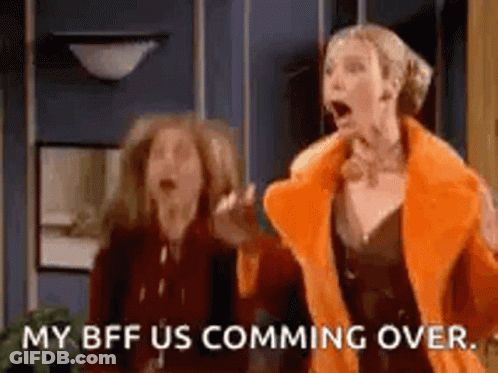 Two Women Are Standing Next To Each Other In A Room . GIF