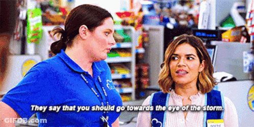 Two Women Are Standing Next To Each Other In A Store And They Are Talking . GIF