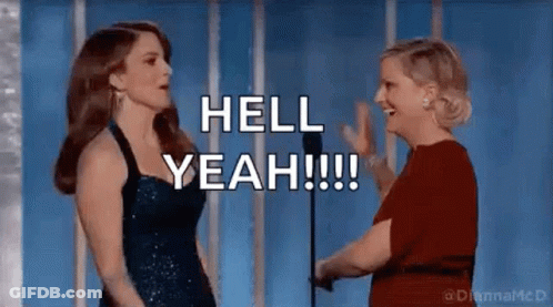 Two Women Are Standing Next To Each Other In Front Of A Microphone And Talking . GIF