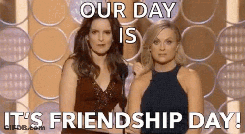 Two Women Are Standing Next To Each Other On A Stage With A Microphone . GIF