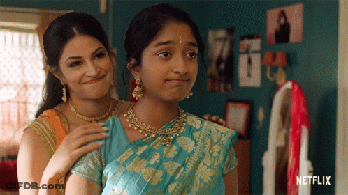 Two Women Are Standing Next To Each Other With Netflix Written On The Bottom Right GIF