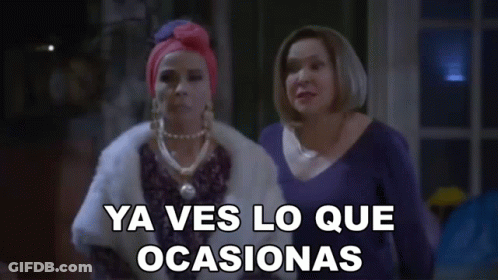 Two Women Are Standing Next To Each Other With The Words Ya Ves Lo Que Ocasionas Written On The Screen GIF