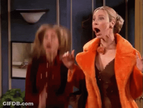Two Women Are Standing Next To Each Other With Their Mouths Open . One Of The Women Is Wearing A Fur Coat . GIF