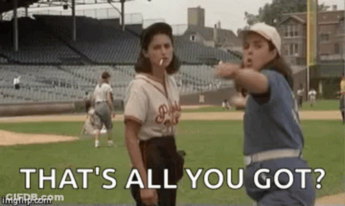 Two Women Standing On Baseball Field Smoking Cigarettes GIF