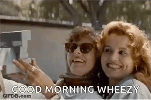Two Women Are Taking A Selfie With A Polaroid Camera And Smiling . GIF