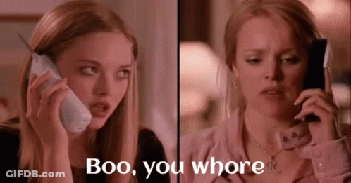 Two Women Are Talking On Cell Phones And One Of Them Says Boo You Whore . GIF