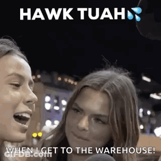 Two Women Are Talking To Each Other In Front Of A Microphone With The Words `` Hawk Tuah '' Written Above Them . GIF